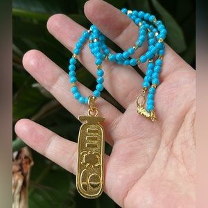 Egyptian revival gold tone cartouche & howlite turquoise bead pendant necklace